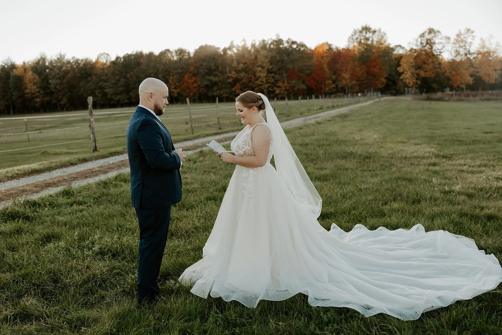 A bride and groom reading private vows