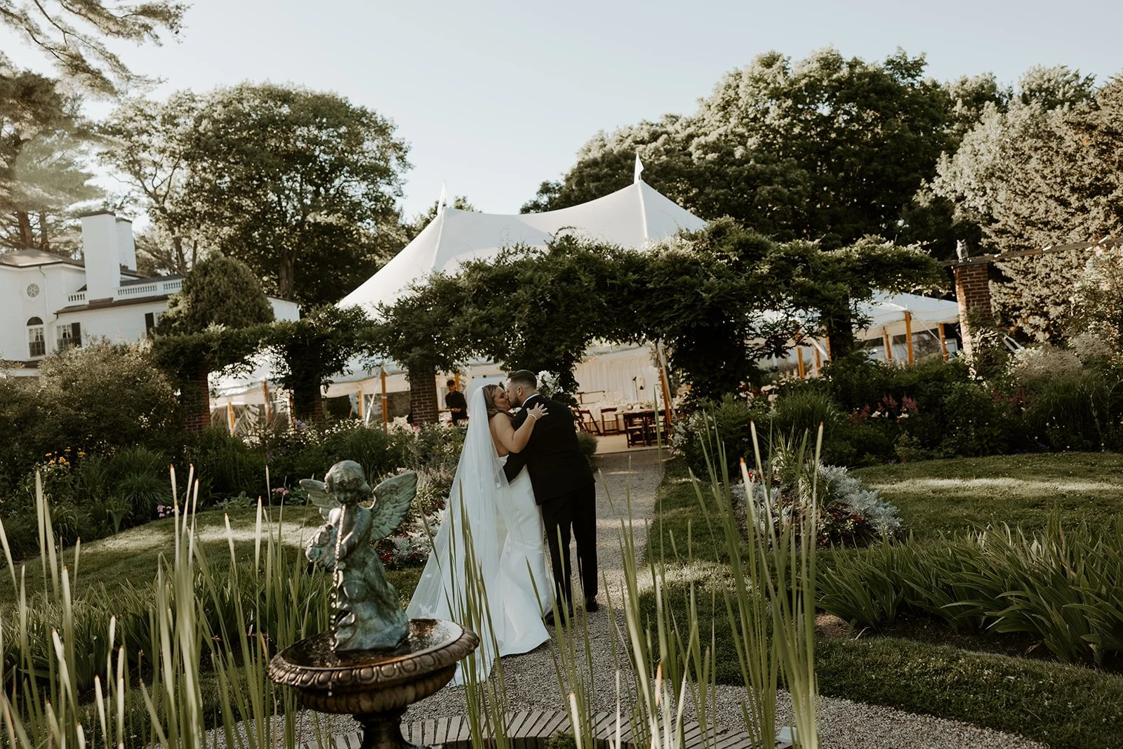 A couple kissing while exiting their wedding ceremony