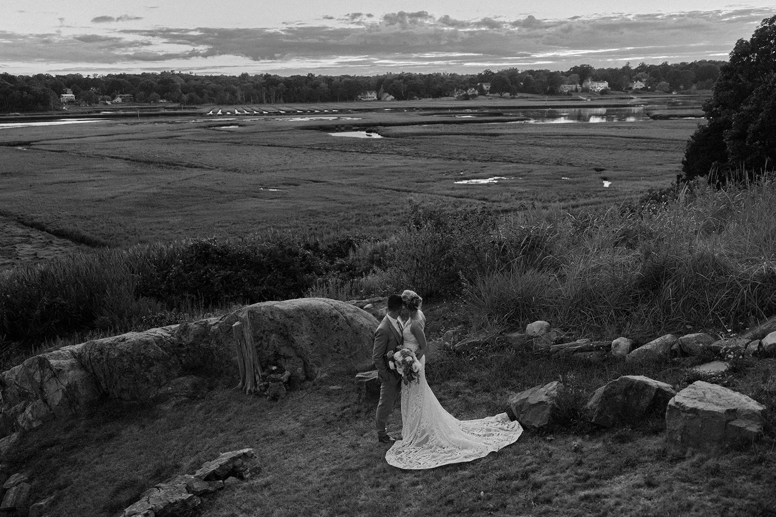 A bride and groom looking out at their South Shore wedding venue