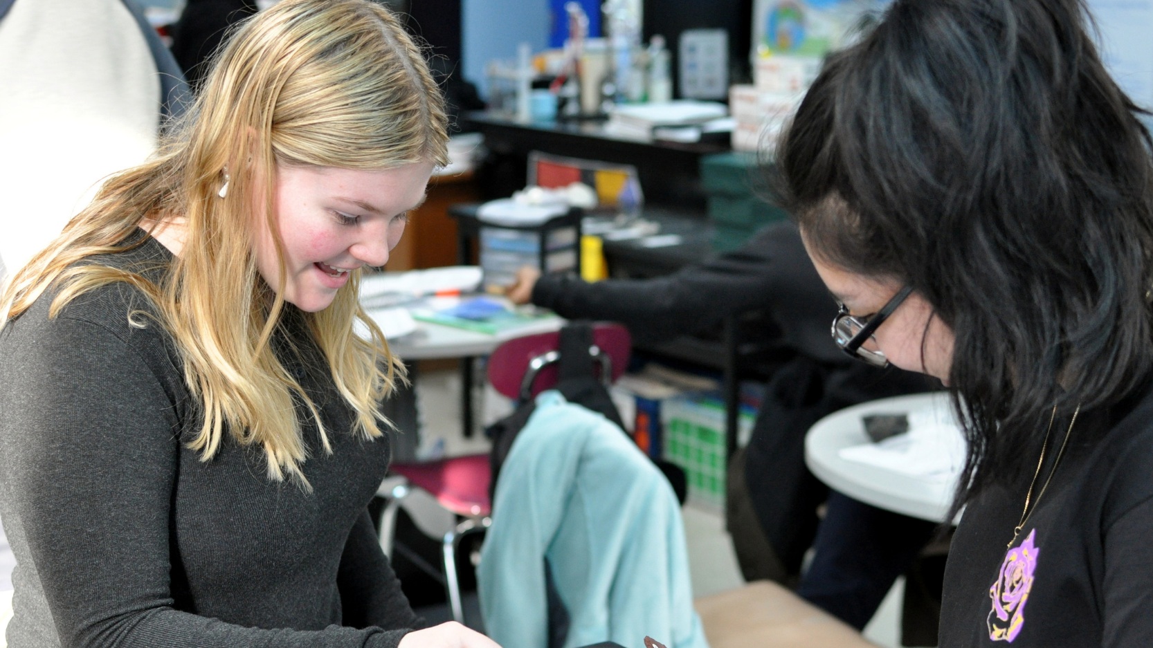 students smile while working together