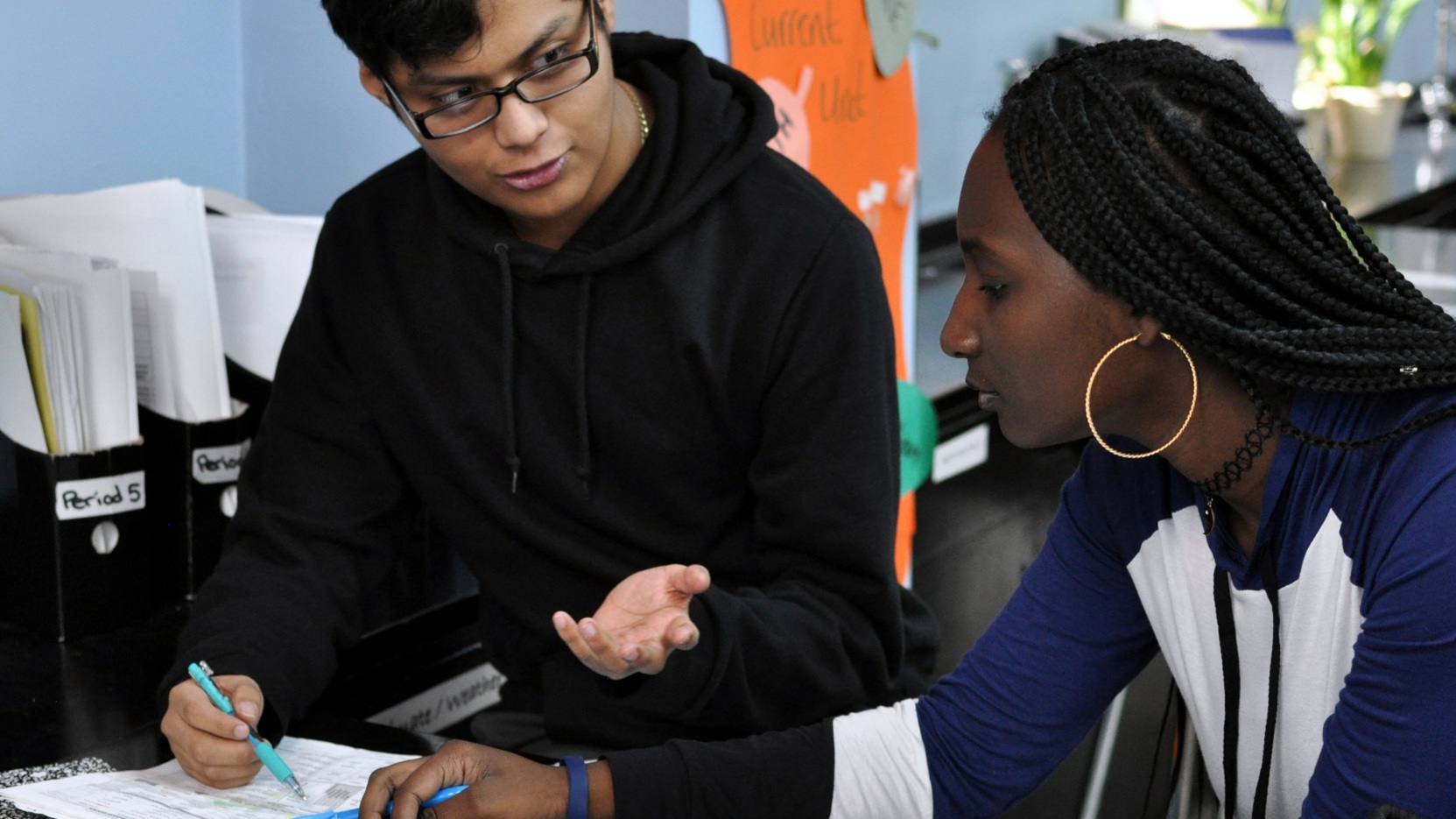 teacher working with student