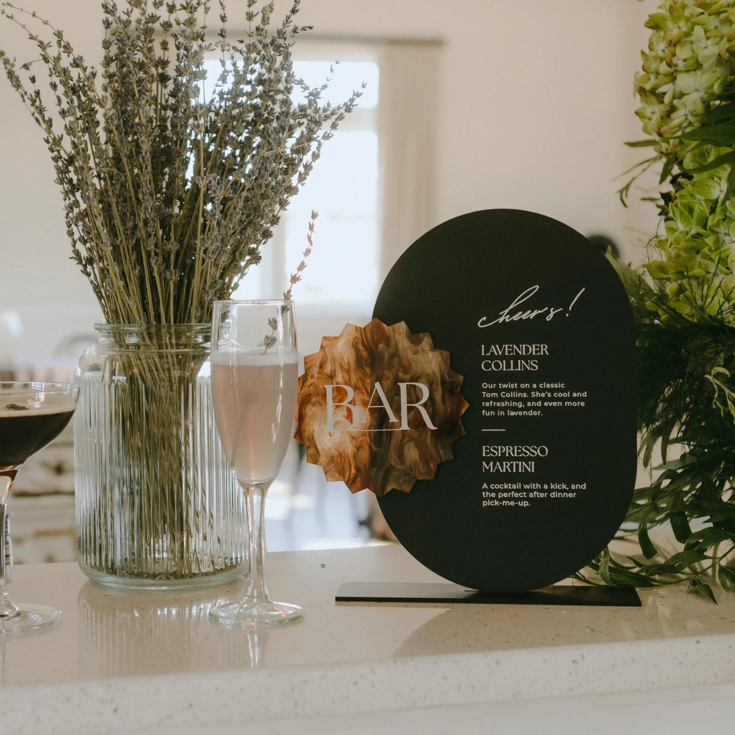 Bar menu but make it decor 🍸

⭐️ Black acrylic with white engraved text featuring a marbled starburst accent 

@ironandemberevents 
@creativeconceptsbylauren
@westfieldflowerbox