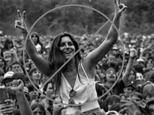 woodstock-audience-member-with-peace-signs.jpg