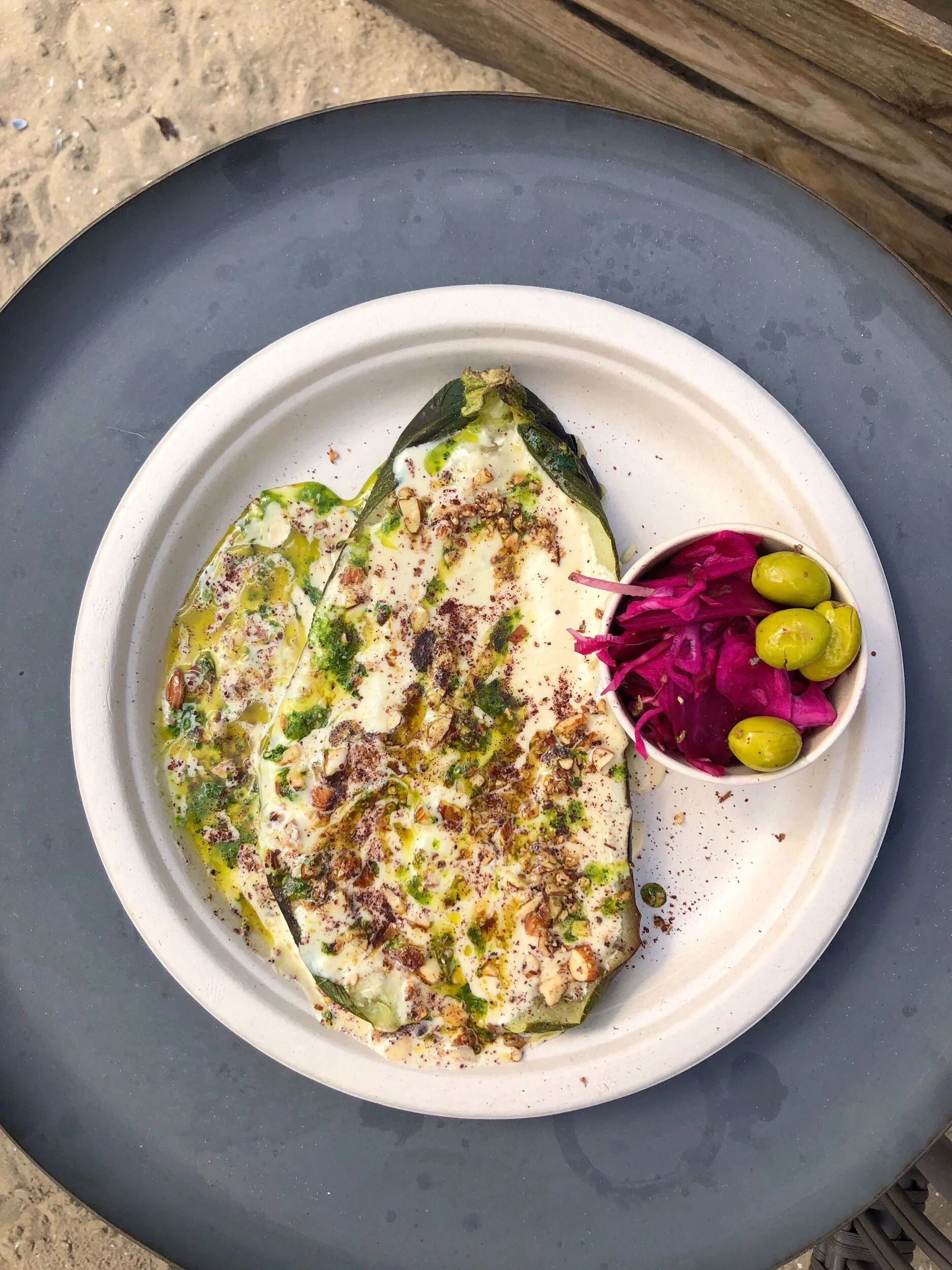 Whole roasted zucchini with orange tarator