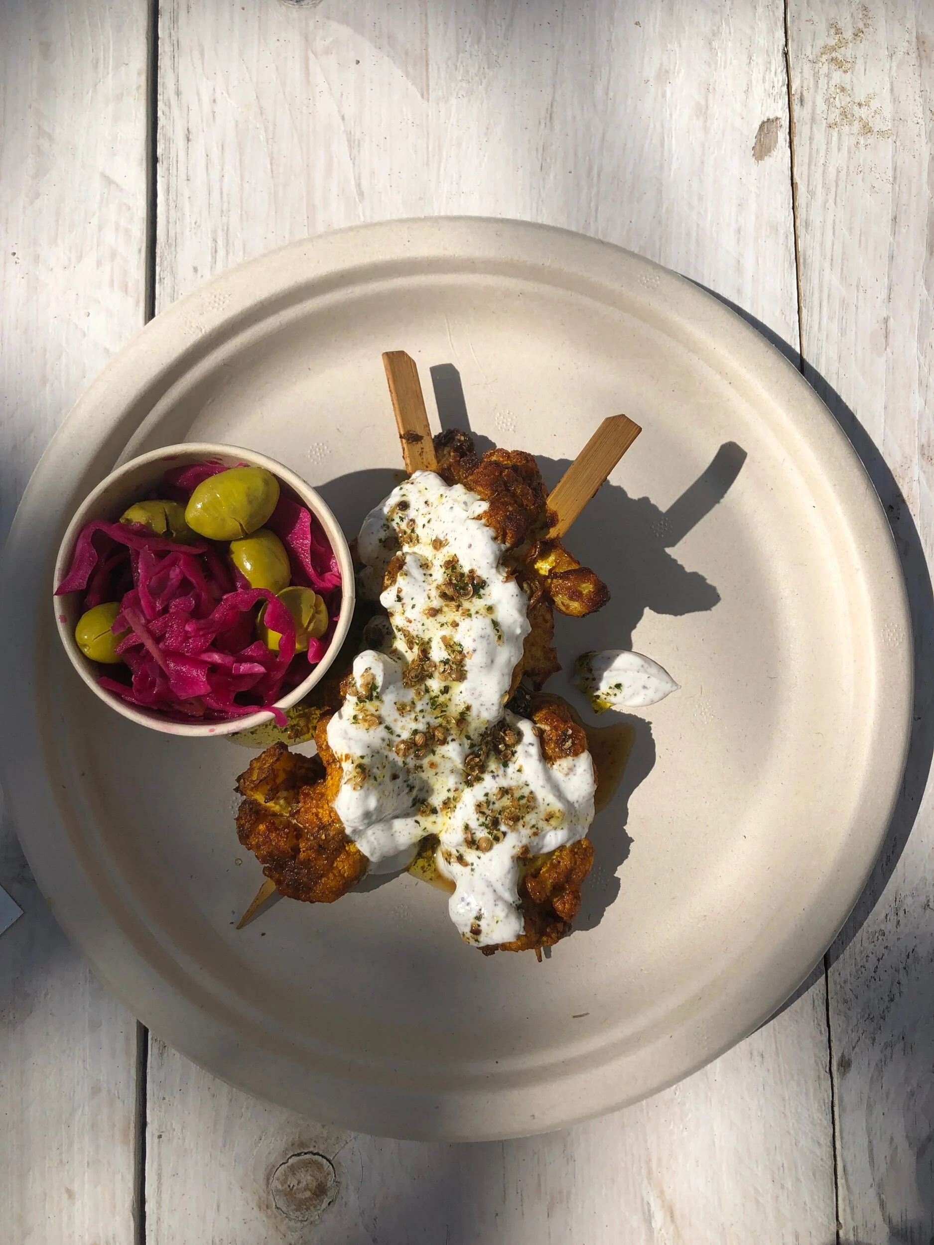 Roasted cauliflower skewers with labneh and coriander mint oil