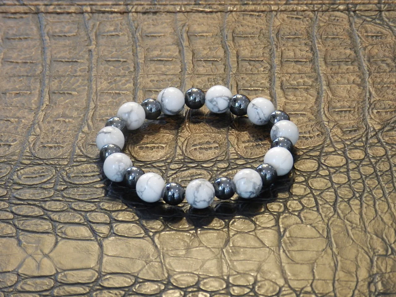 Handmade with 12mm Howlite and 10mm Stainless Steel.  Fits Wrists Size: 7.5” - 8”