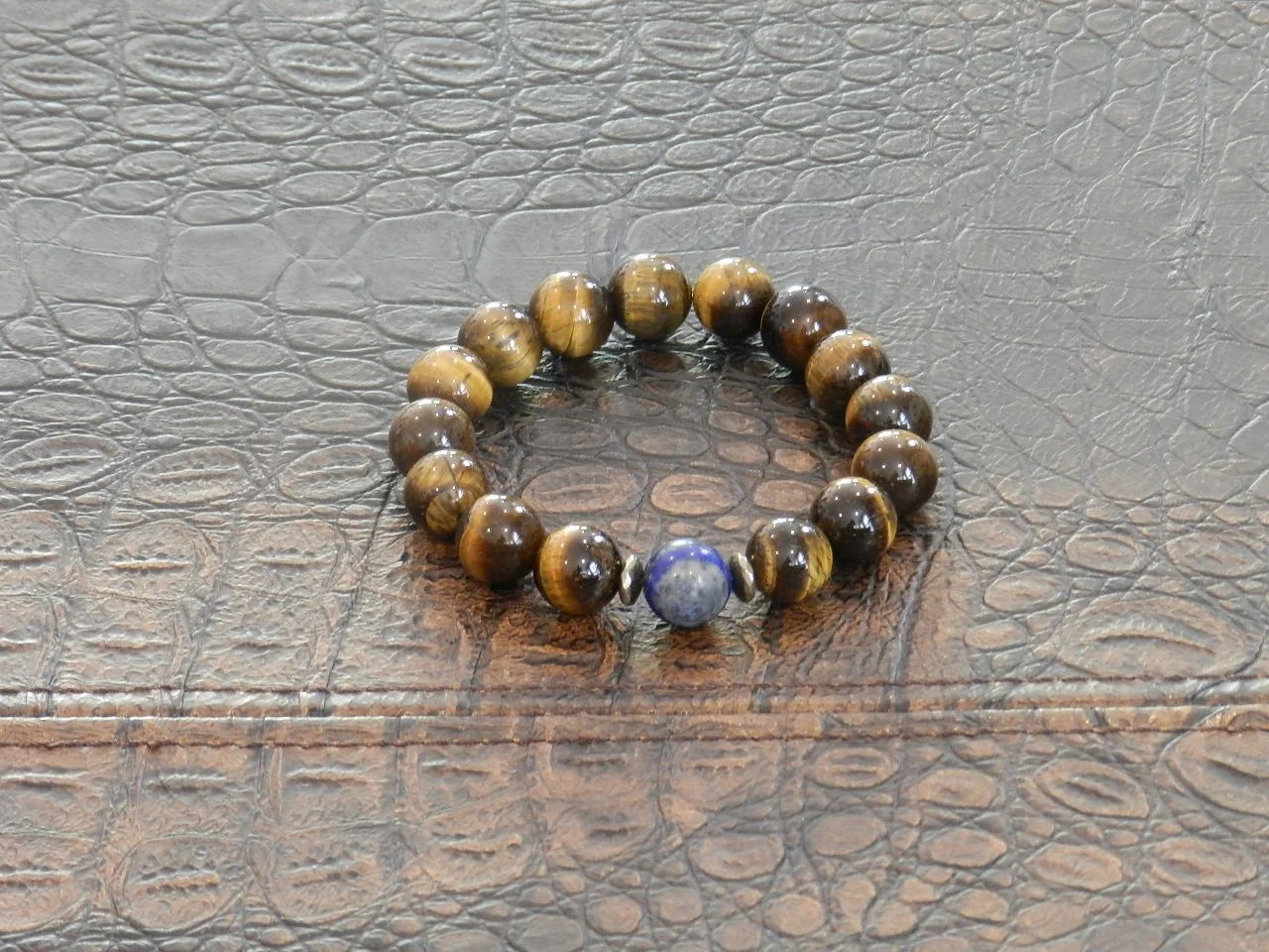 Handmade with 14mm Tiger’s Eye and Pyrite Spacers anchoring a 14mm Sodalite Accent Stone  Fits Wrists Size: 7” - 7.5”