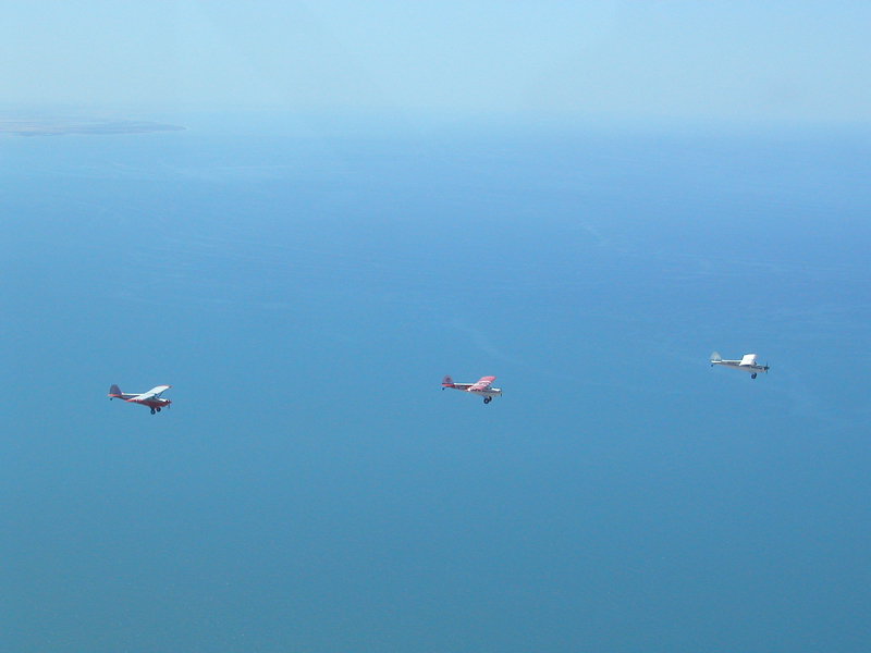 three aviat husky airplanes