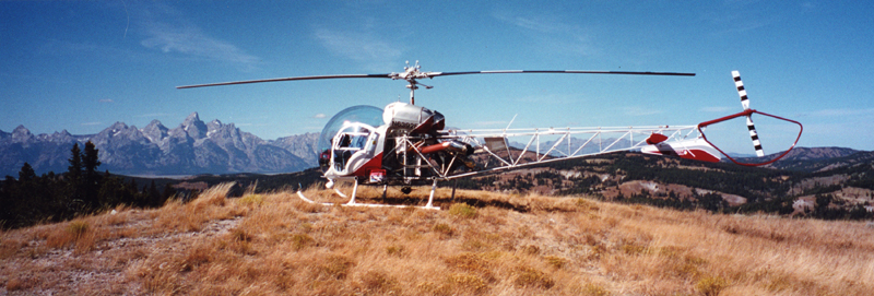 Bell 47 landed with tetons in background