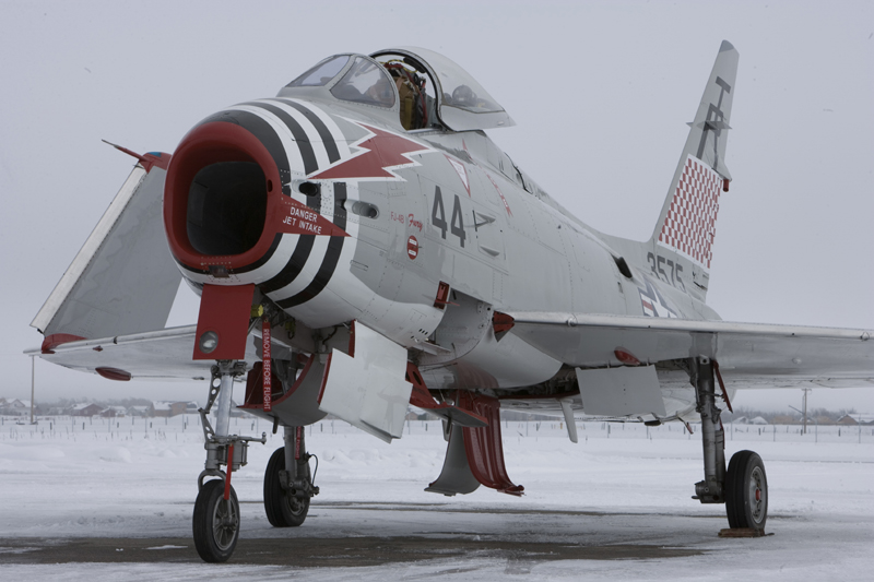 North American FJ-4 Fury folded wings on snowy runway