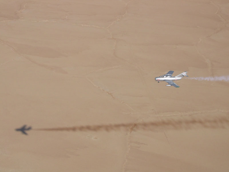 Mikoyan-Gurevich MiG-15 streaking over desert
