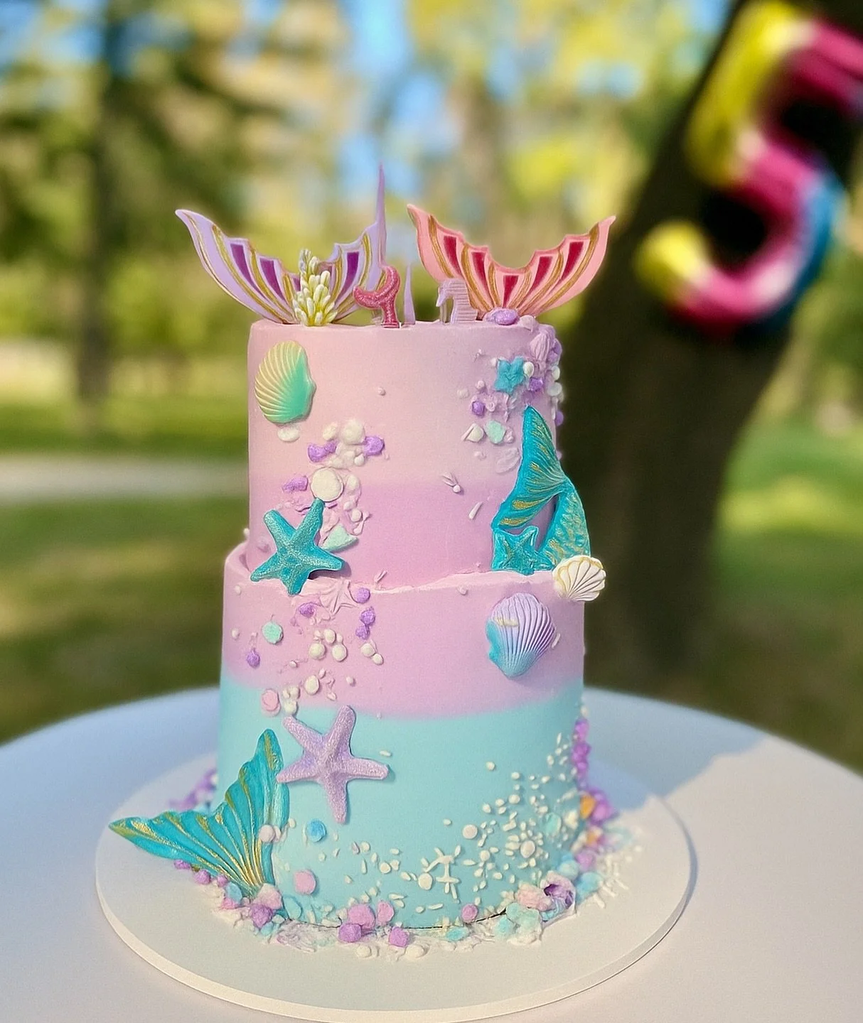 Had to go into the archives for this little gem! Made this mermaid cake for my niece&rsquo;s very special 5th birthday shell-ebration in Central Park, NY 🐚🧜&zwj;♀️🩵

#cakedecorating #5thbirthdaycake #mermaidcake #buttercream #ombrecake