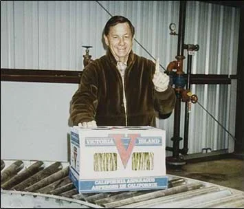 Graydon “Nic” Nichols Celebrates the First Package of Victoria Island Farms Asparagus in 1987.