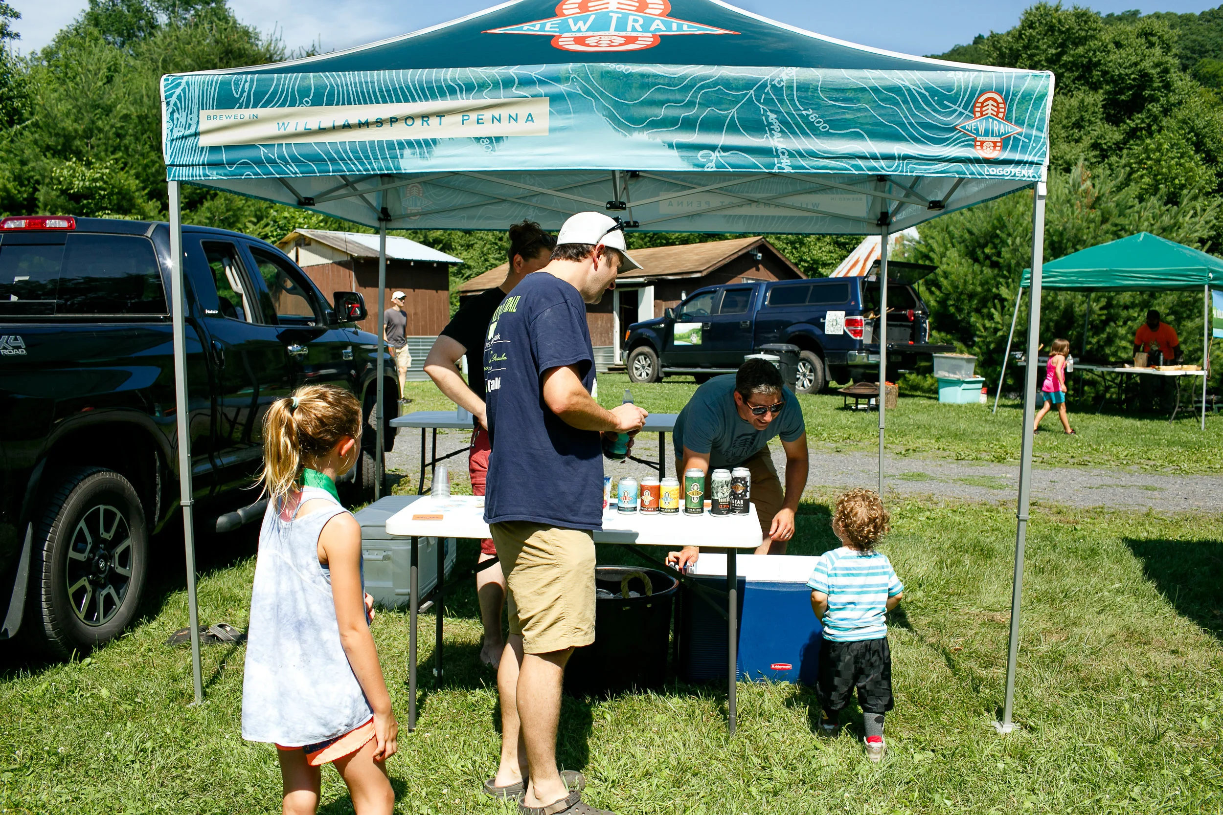 New Trail squad handing out beers (to the adults) and juice pouches at the 2018 Little Loggers Trail Fest.