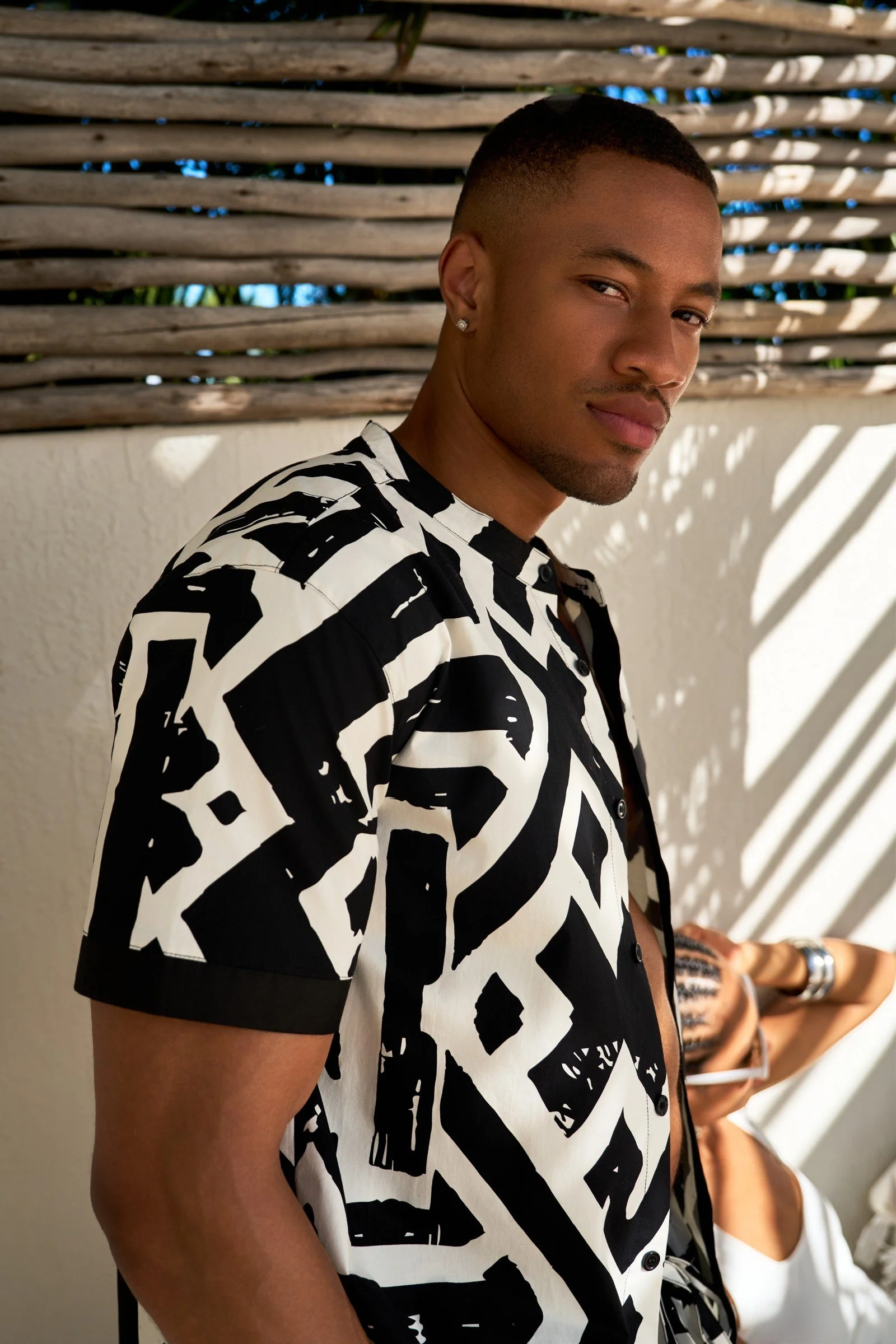D’IYANU menswear portrait with geometric African-inspired print