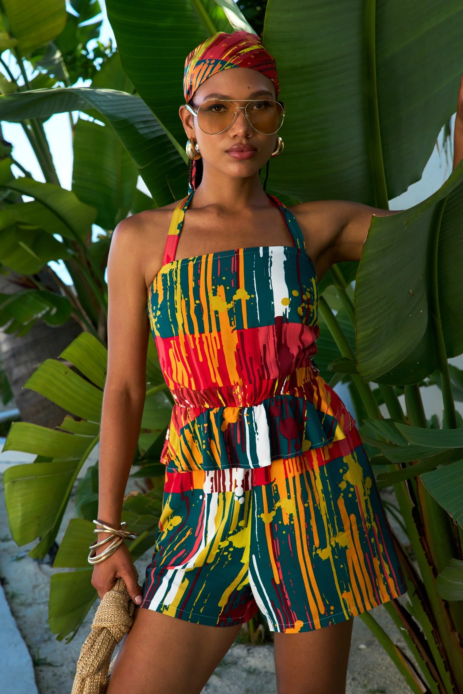 D’IYANU printed summer dress framed by tropical greenery