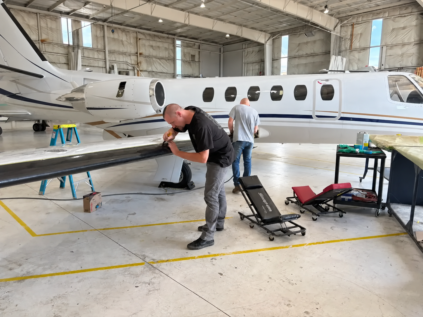 Haggan technician installing a de-ice boot on a Citation wing
