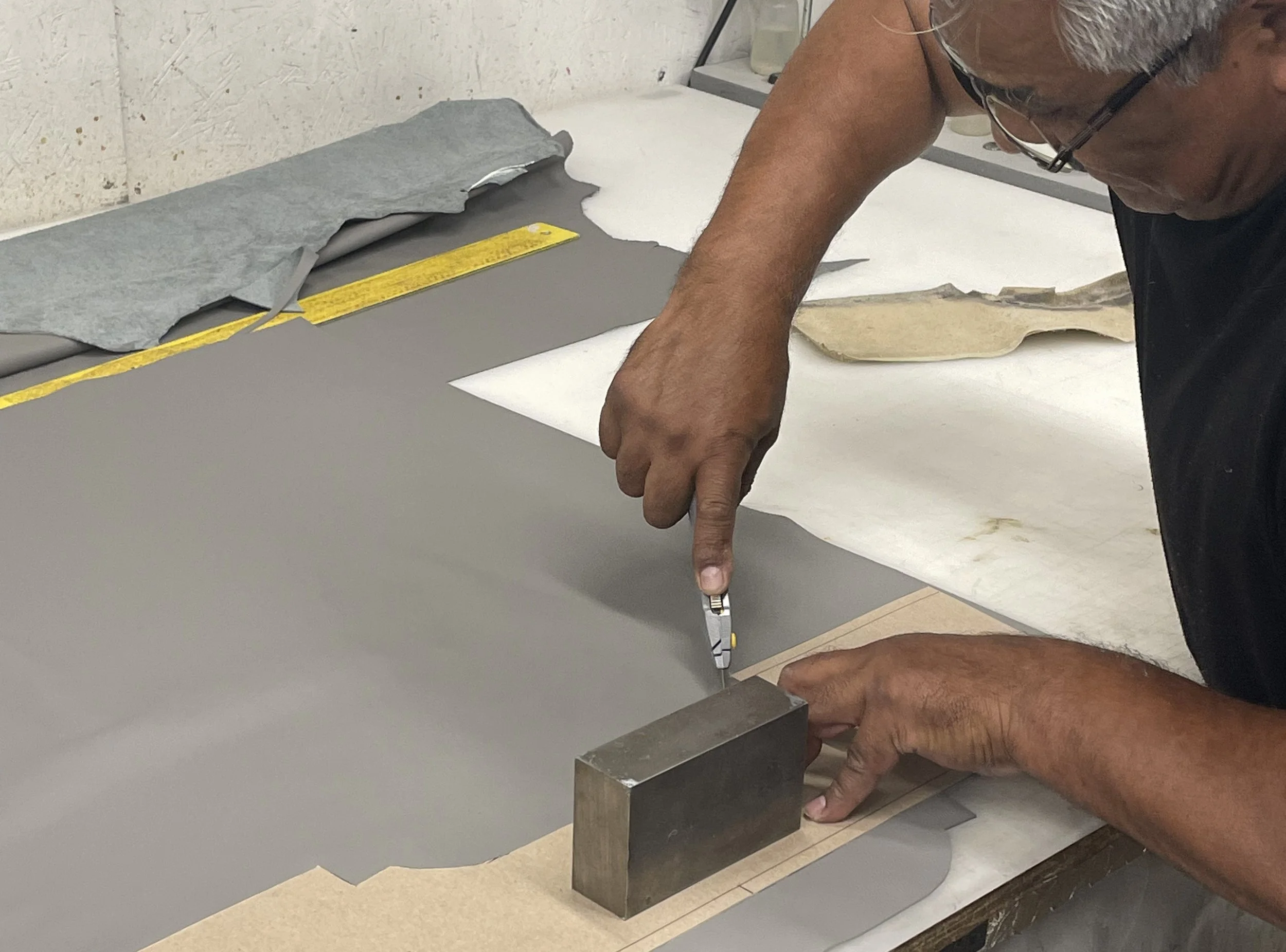 Hand-cut leather for aircraft seating at Haggan Aviation interior shop