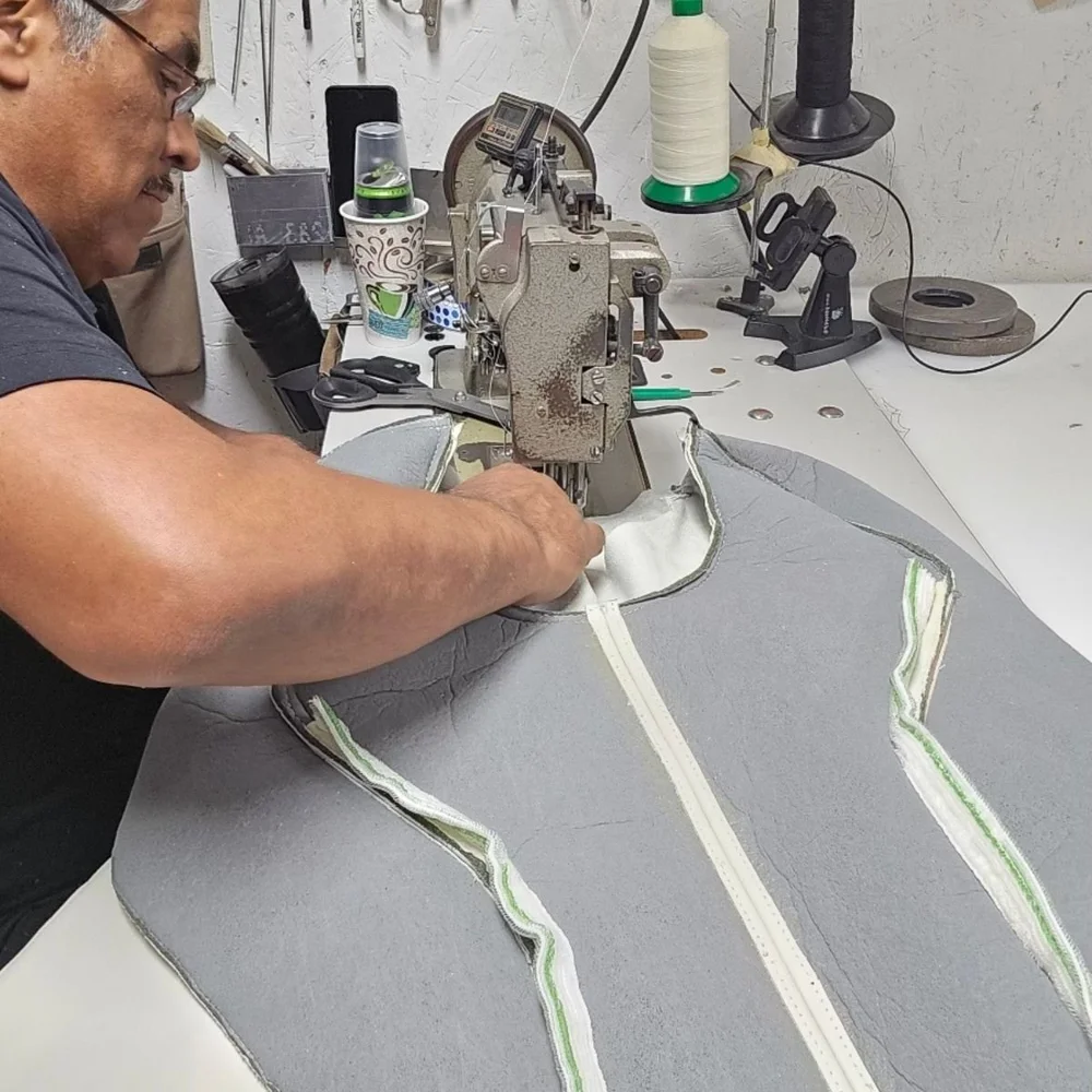 Haggan Aviation craftsperson sewing aircraft interior upholstery by hand