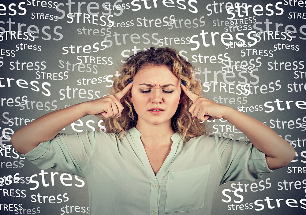 Woman-stressed-pointing-fingers-to-temple-small.jpg