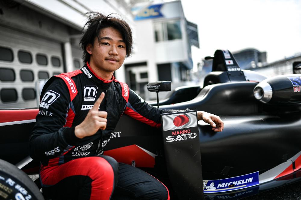 Marino Sato celebrates his pole position after qualifying.