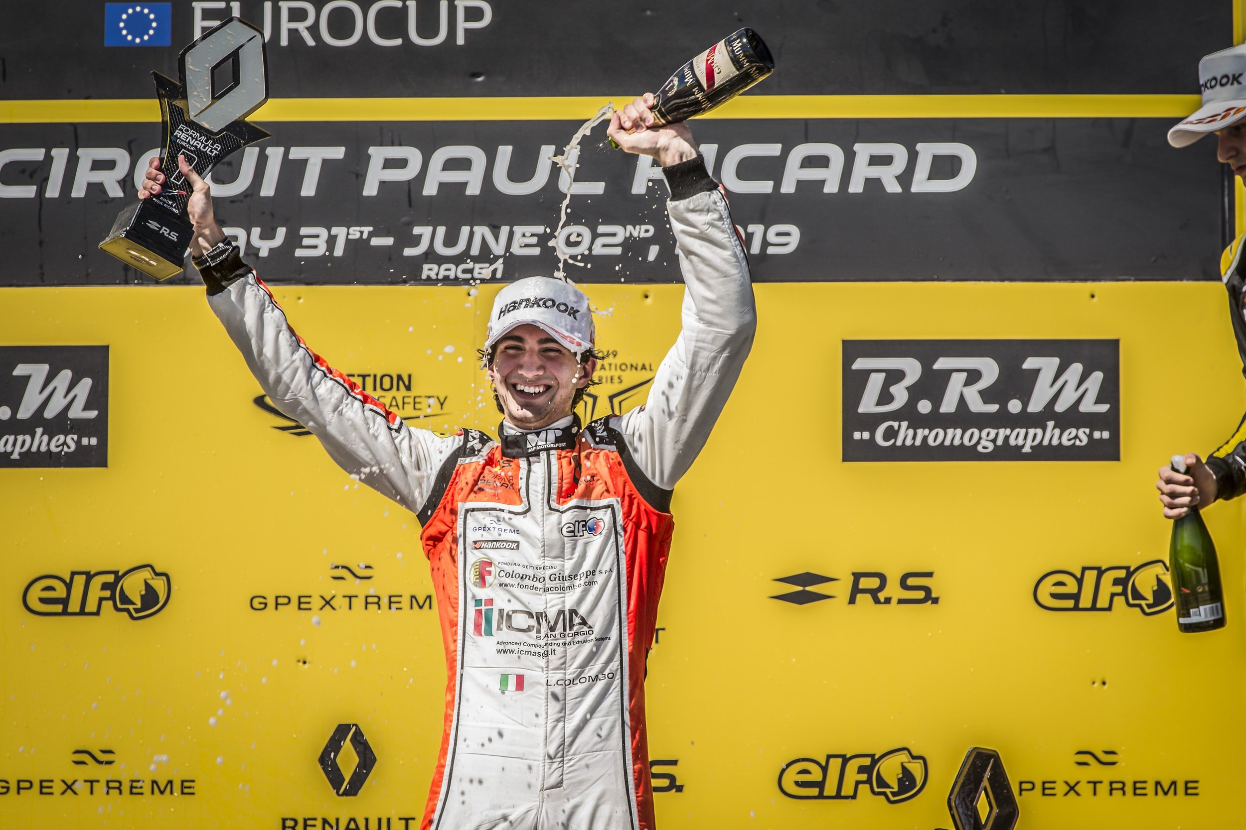 Lorzeno Colombo celebrates his Race 1 victory yesterday.