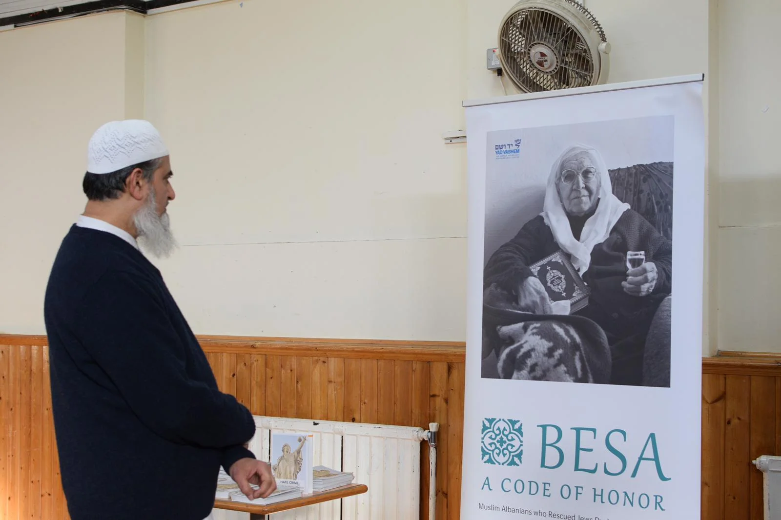 A member of the Muslim community looks at part of the exhibit about Islamic heroes of the Shoah at the love thy neighbour exhibition.