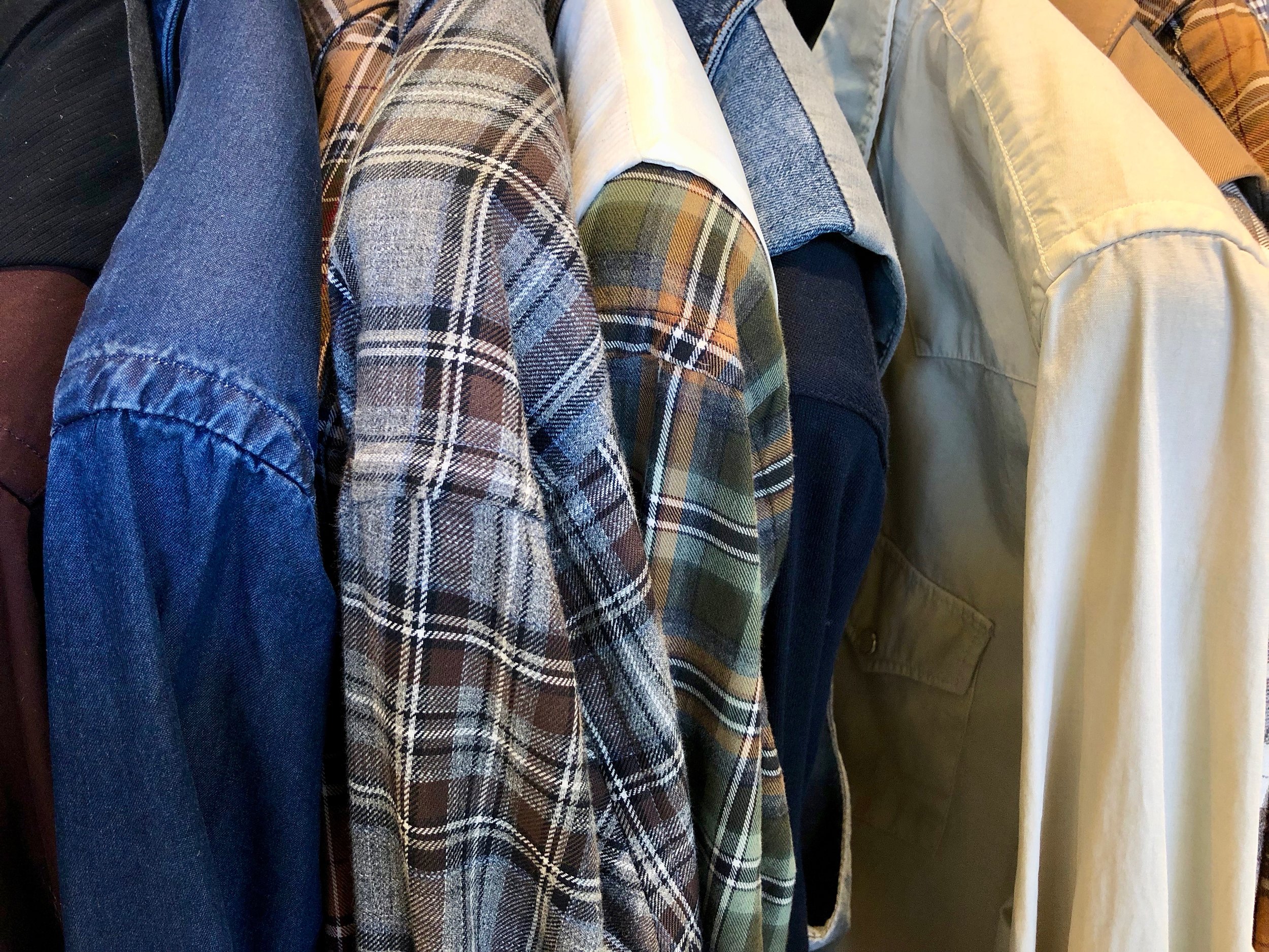 Close-up of a dizzying choice of shirts. Photo credit: @LucaMontini