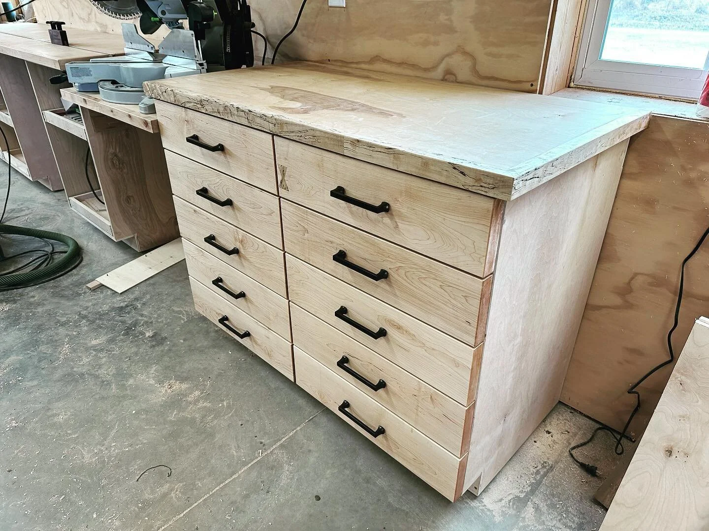 #mitersawstation is complete. Drawer faces installed and finish applied. Excited to FINALLY have some shop furniture. #woodworking #diy #cabinets #maple