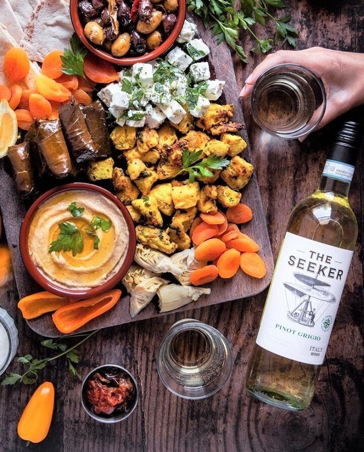 What's the scoop on tonight's plans? You can find us dipping into our Mediterranean-inspired platter paired with our Italian Pinot Grigio!