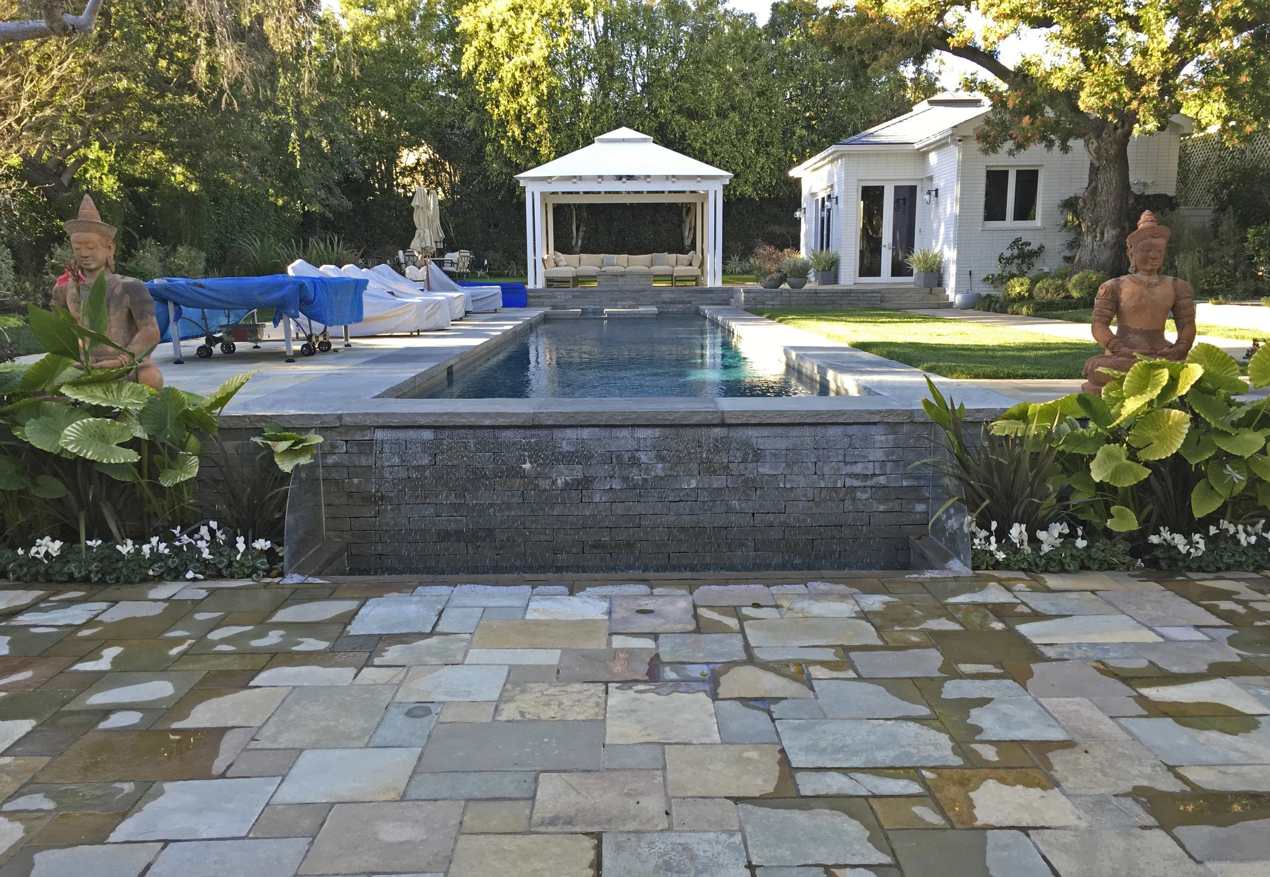  WRIGHT RESIDENCE  An existing backyard was transformed into a contemporary environment for Southern California outdoor entertaining. Granite pavers define a new enlarged rear patio, walkways and gazebo patio at the far end of the pool. The existing 