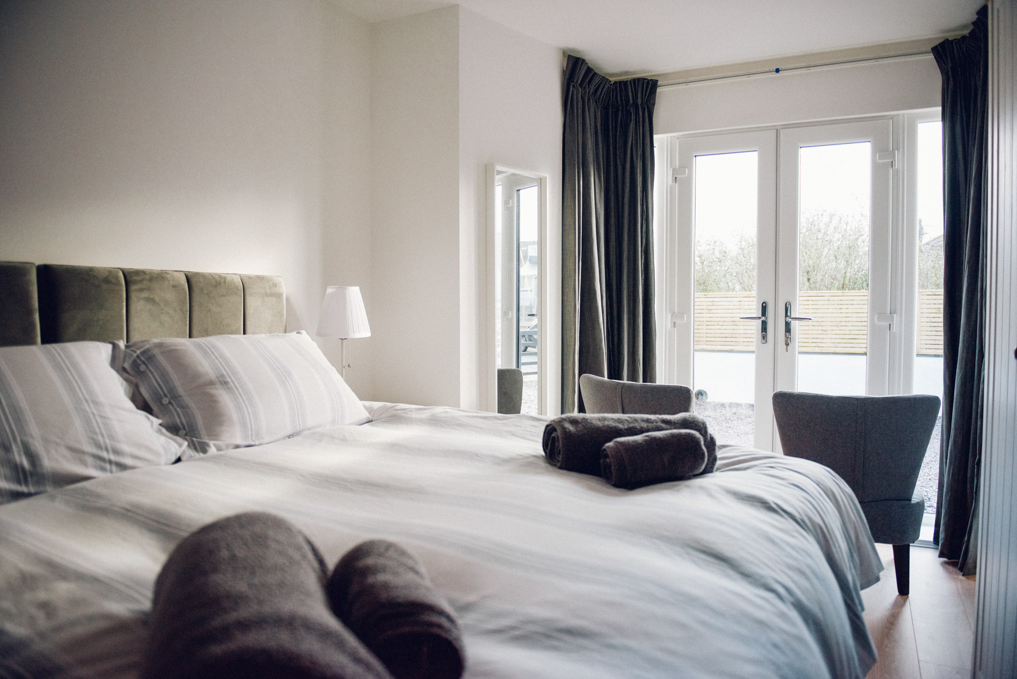 Double bedroom with armchair and views