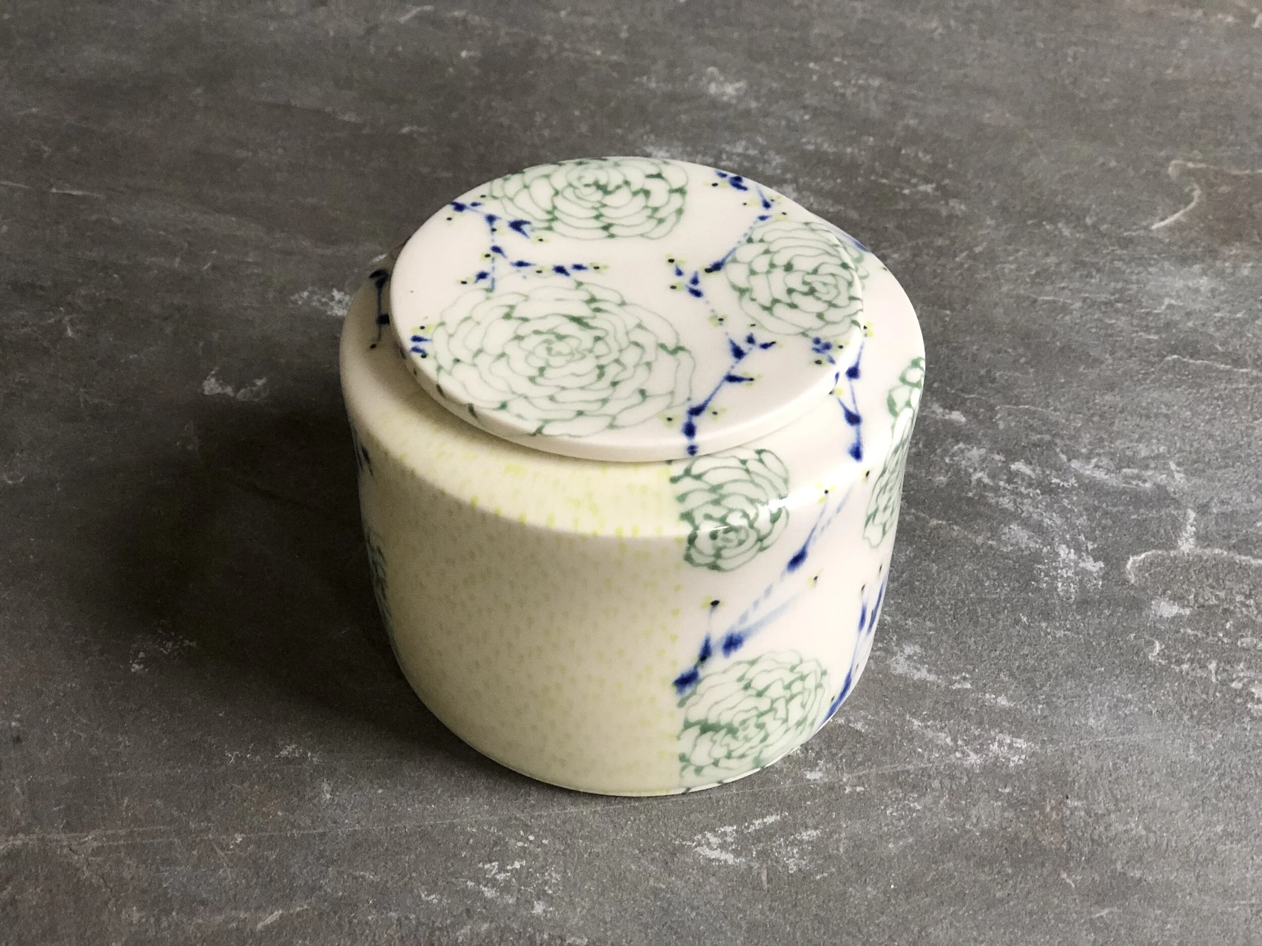 Box With Green Chrysanthemums, Blue Branches, and Yellow Droplets