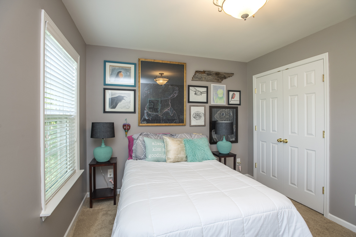 This guest room turned into Chris’ art gallery! This wall color I used throughout a lot of the house - Sherwin Williams Perfect Greige.