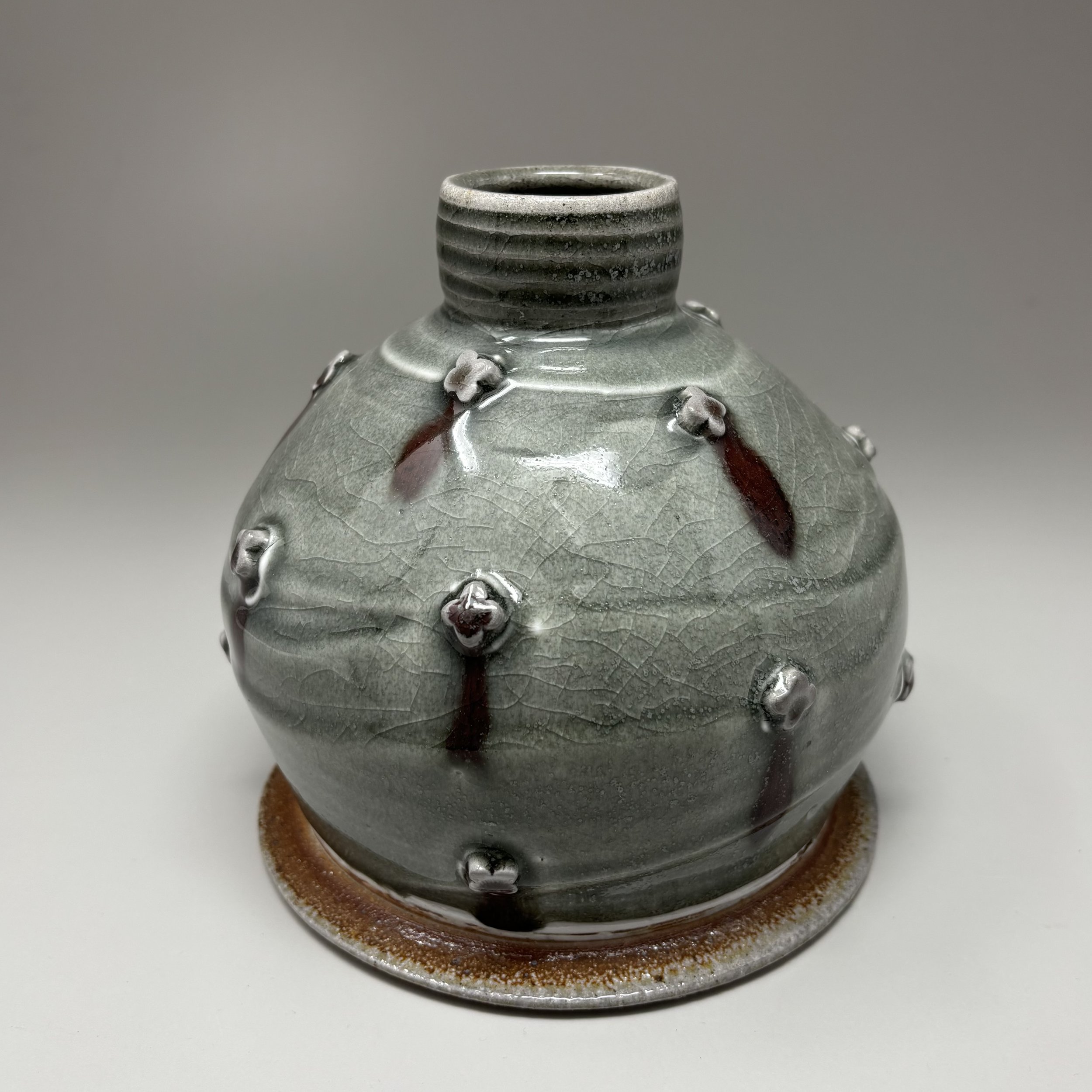 Gray vase with sprigs