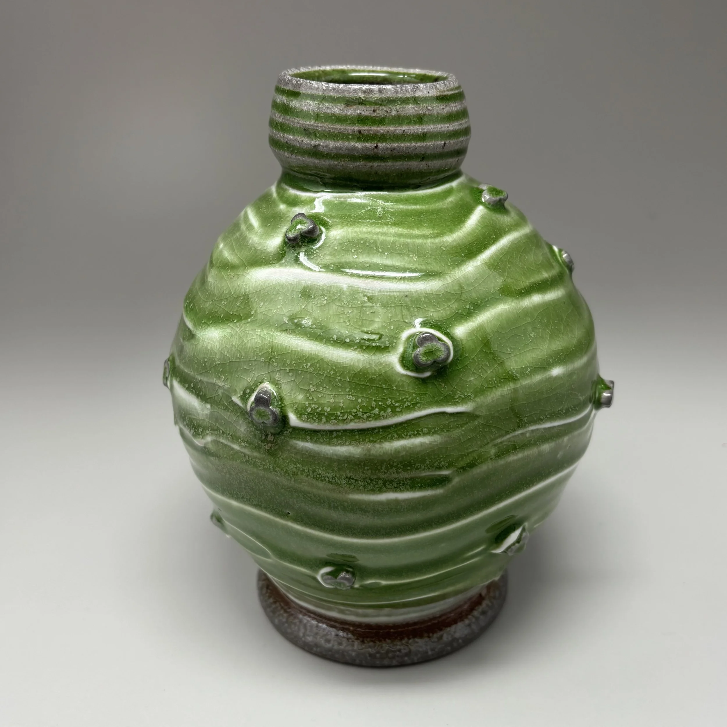 Green vase with sprigs