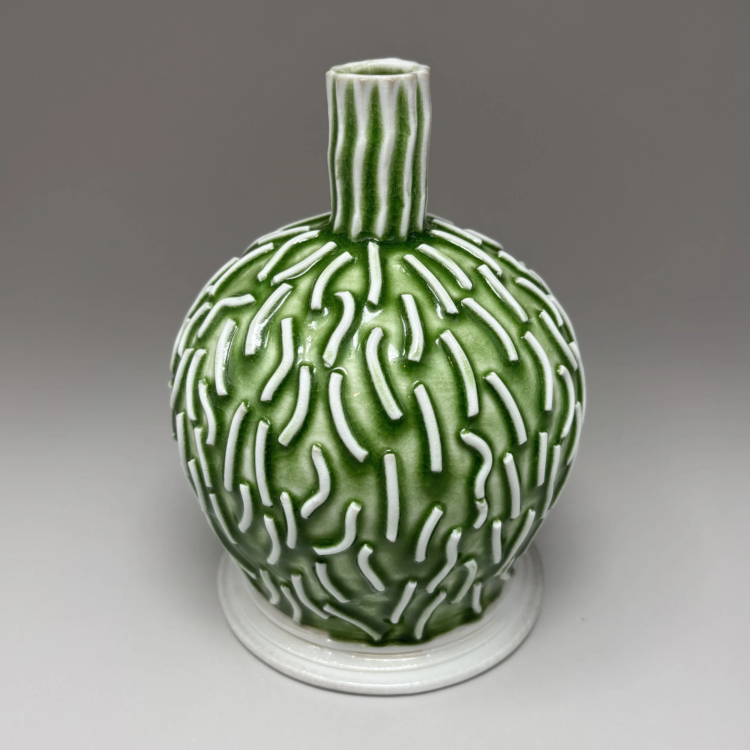 Green porcelain vase with squiggles
