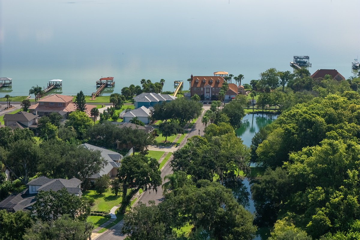 Aerial close-up of homes and canal access in Sabal Chase near Indian River, Cocoa FL