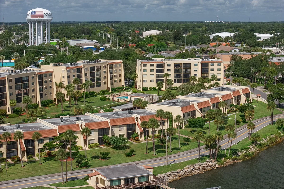 Aerial view of 115 River Drive condos along the Indian River, Cocoa F