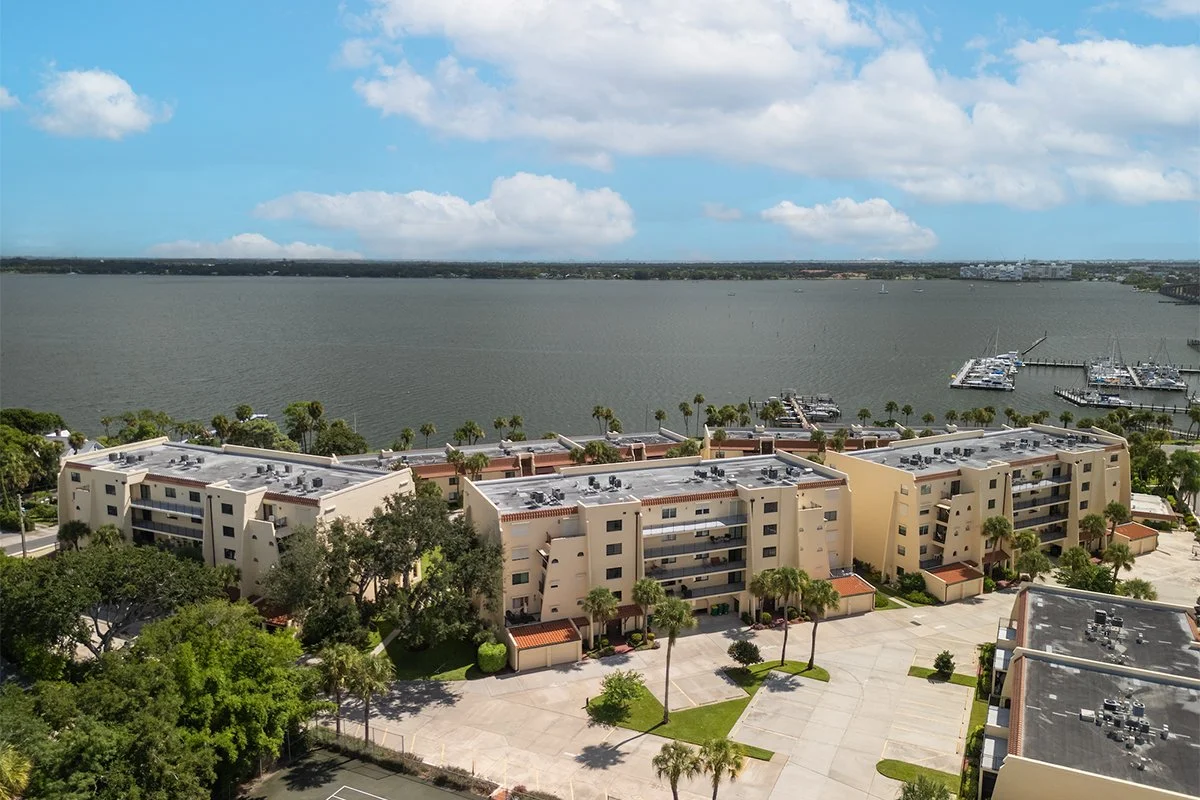 Aerial view of 115 River Drive condos along the Indian River, Cocoa F