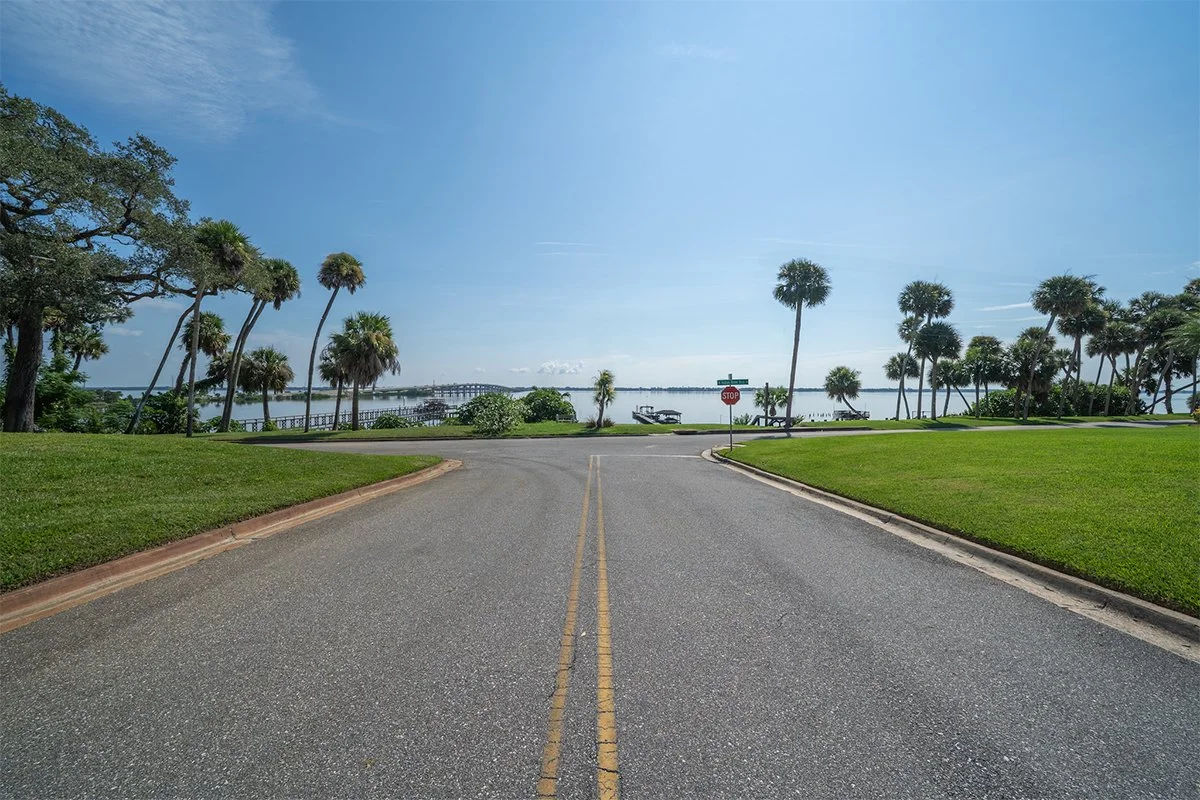 Residential street with river in River Heights, Cocoa
