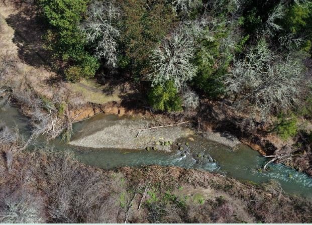 Drone photo of Hogan site with 165 feet of eroding bank. 3/30/24