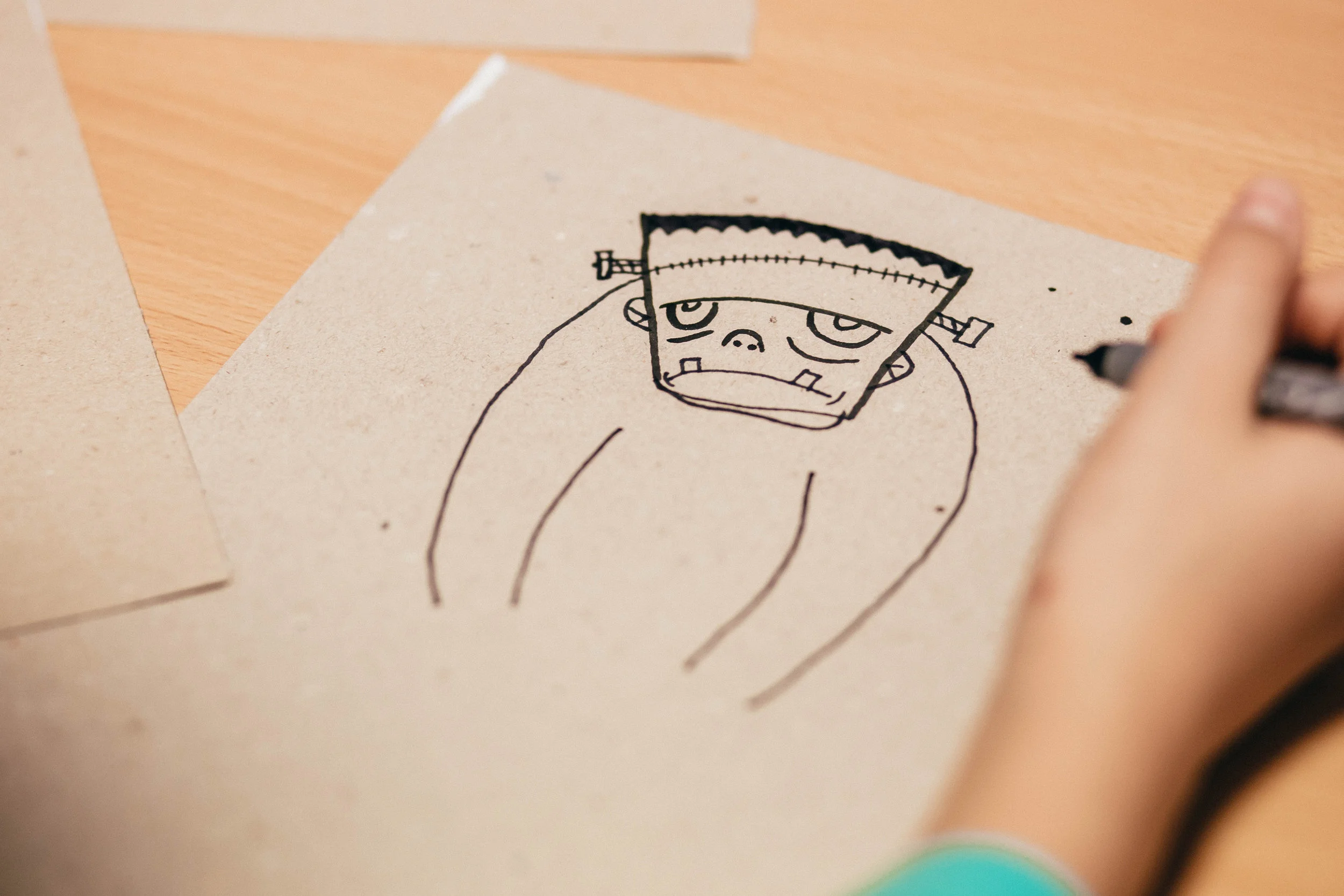 Canva - Kid Draws Cartoon Character Figure.jpg