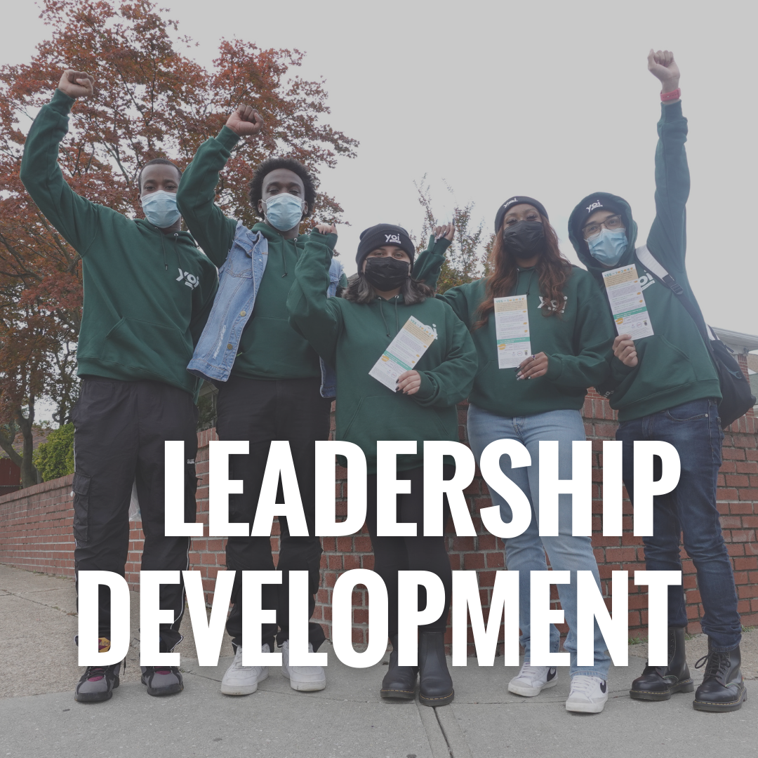  Leadership Development: 5 youth standing together with their arm raised in power and holding up signs.  