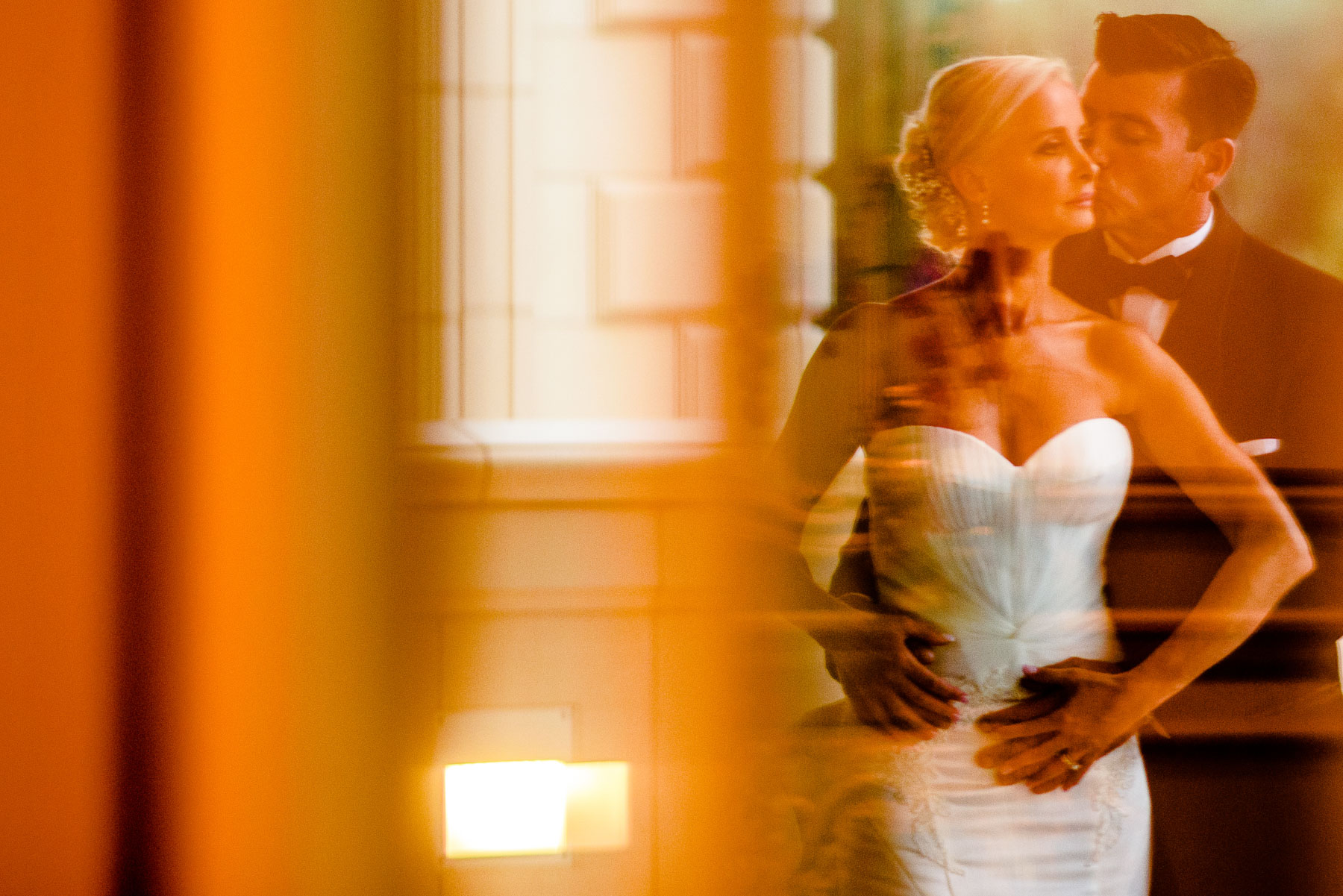 The Legacy Castle Wedding bride and groom portrait door reflecti