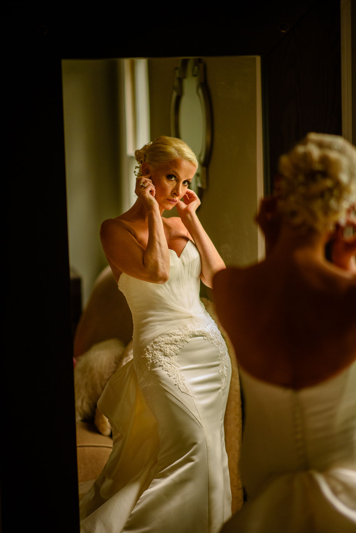 The Legacy Castle Wedding bride gets ready by window