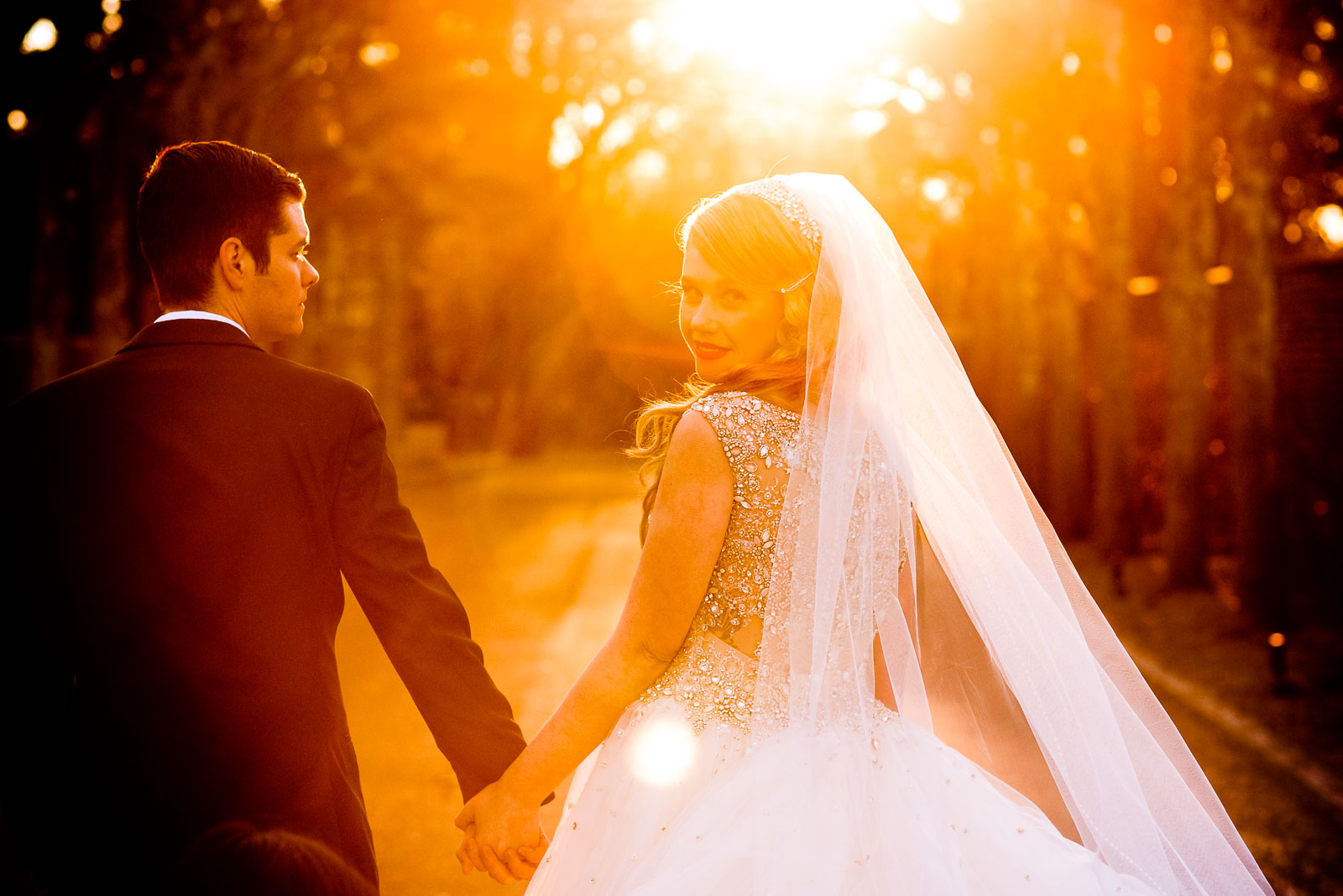 NYIT de Seversky Mansion Wedding bride and groom sunset walk