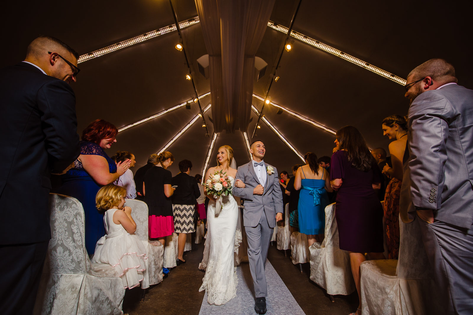 Bride and groom leave after the ceremony