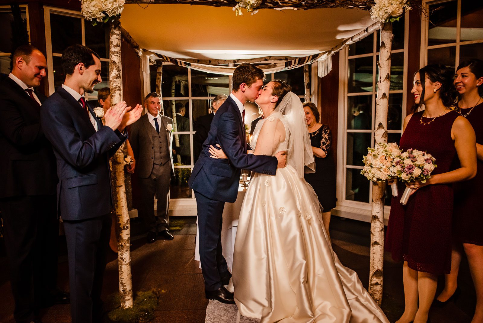 Bride and groom first kiss