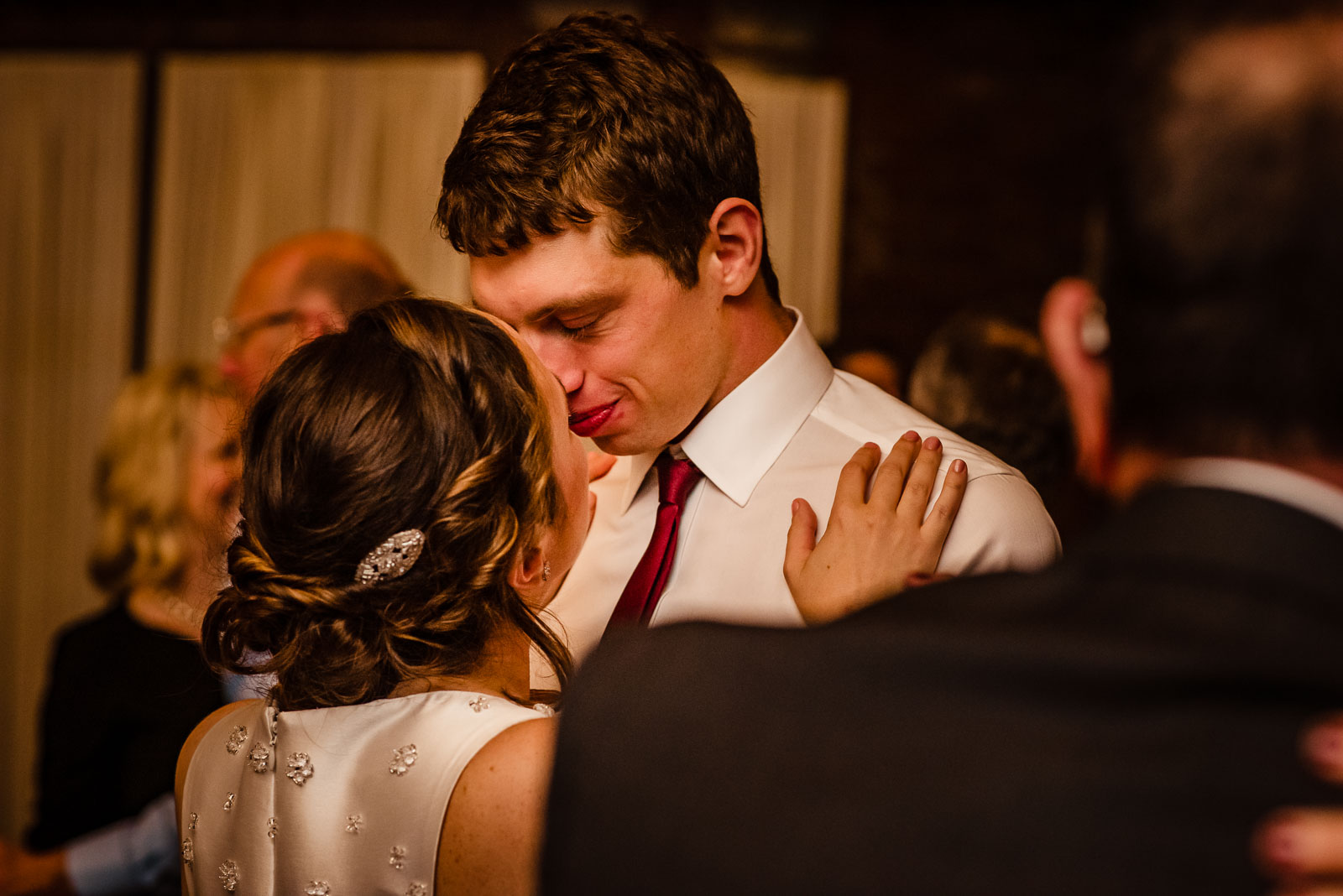 Bride and groom dance at reception